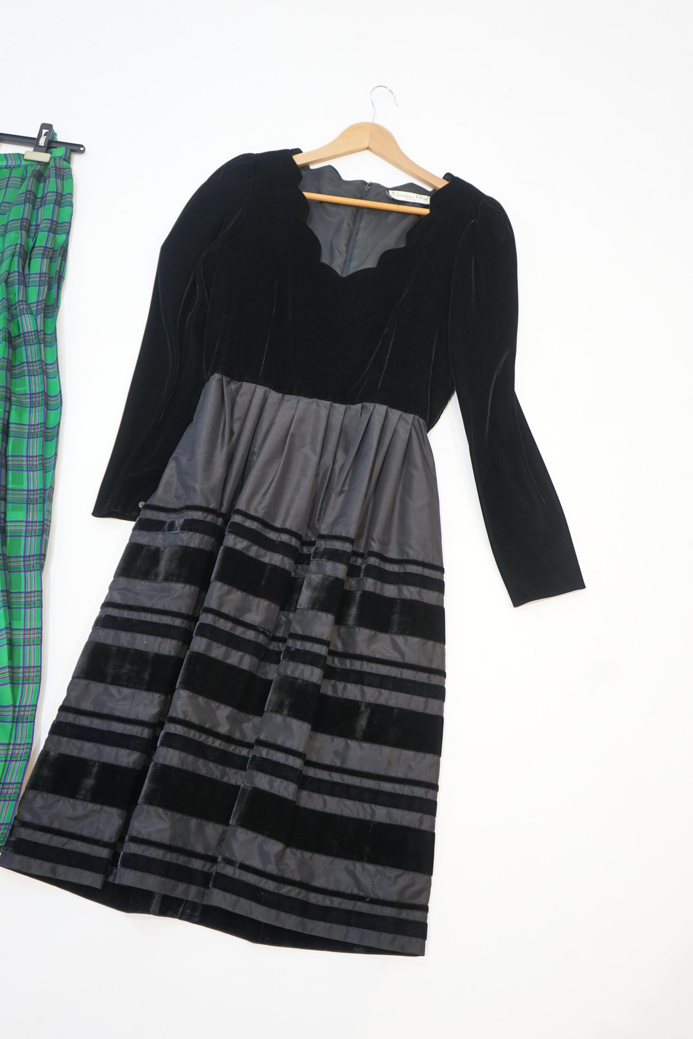 Christian Dior. A pleated long tartan pattern silk skirt, size ‘small/medium’ and a velvet and satin mid length evening dress, no size given, estimated at medium